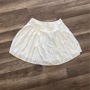 Red pearl top and white skirt